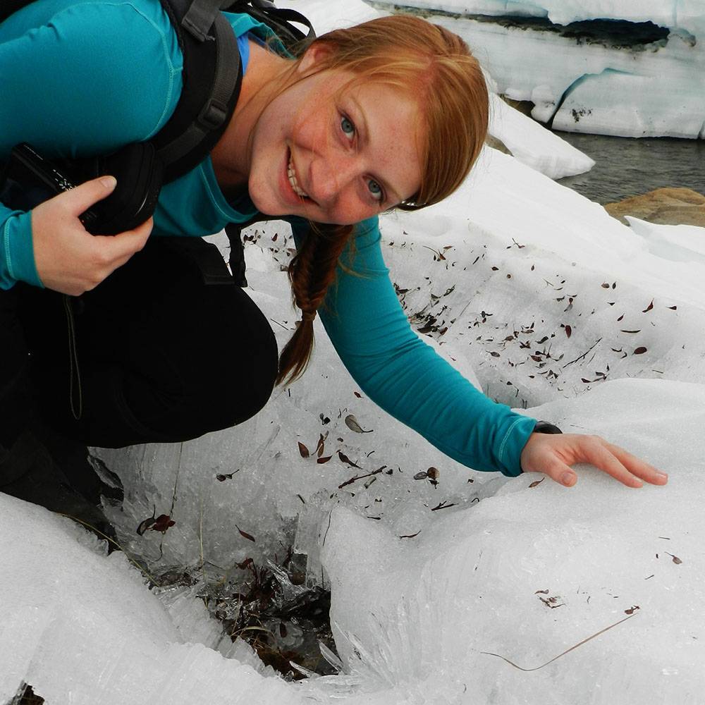 Kelsey smiles near ice.